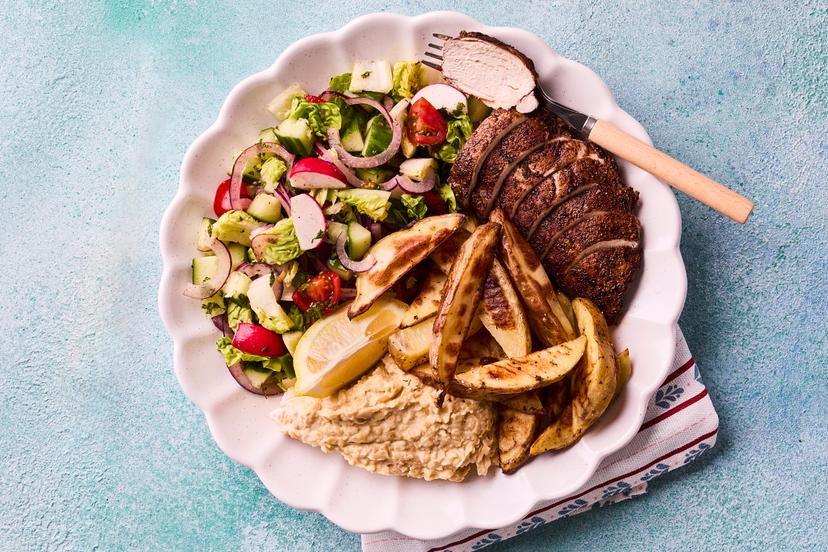 Prepare to be wowed! This Middle Eastern takeaway classic combines juicy chicken rubbed in our special shawarma spice mix, with home-made houmous (you’ll never want to buy ready-made again), a refreshing minty salad and chunky potato wedges. It’ll take you straight to the souk...