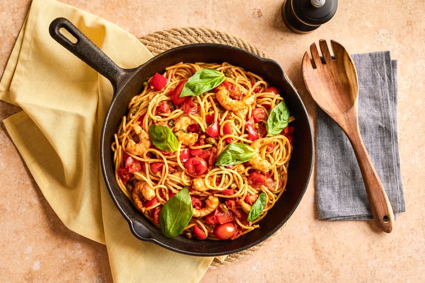 This is flavoursome, fuss-free and fast. Salty capers, spicy fresh chilli and a splash of cider vinegar add welcome depth to the classic tomato sauce. Toss in some plump prawns and spaghetti and you’ve got yourself a powerhouse of a pasta dish.