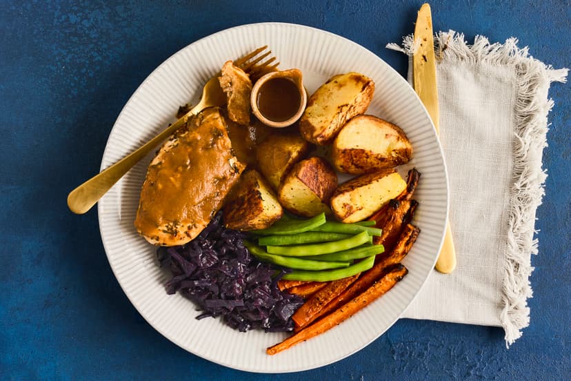 Special enough for Sunday. Easy enough to whip up after a day at work. This winner of a chicken dinner features garlic, rosemary and thyme-coated chicken breasts, roasted carrots and potatoes, herby red cabbage and a rich mushroom and onion gravy.