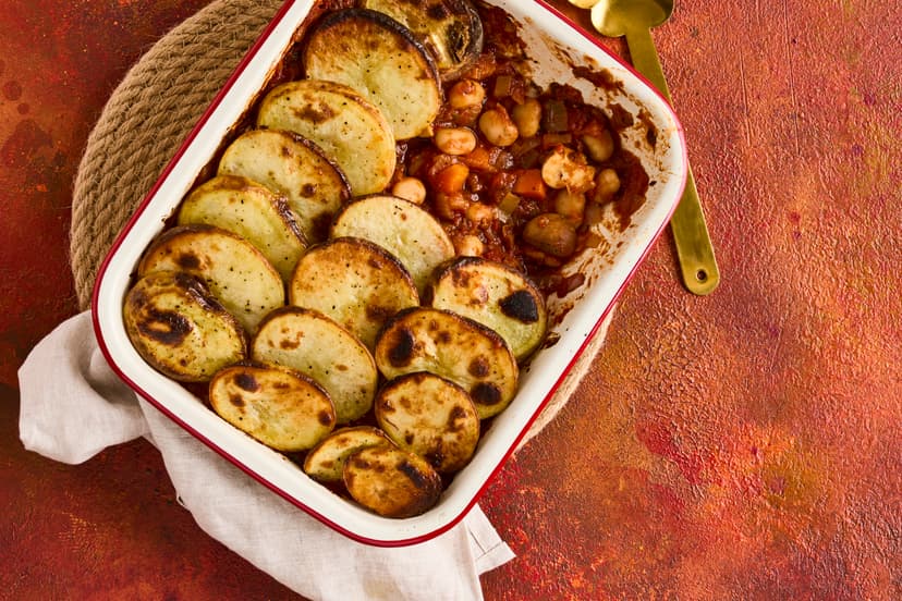 Lancashire hotpot is the daddy of comfort food, and our slimming-friendly, plant-based version is every bit as satisfying. Sink your serving spoon through the crispy potato topping into a medley of butter beans, chestnut mushrooms, leek and carrot in a garlic and herb tomato sauce.