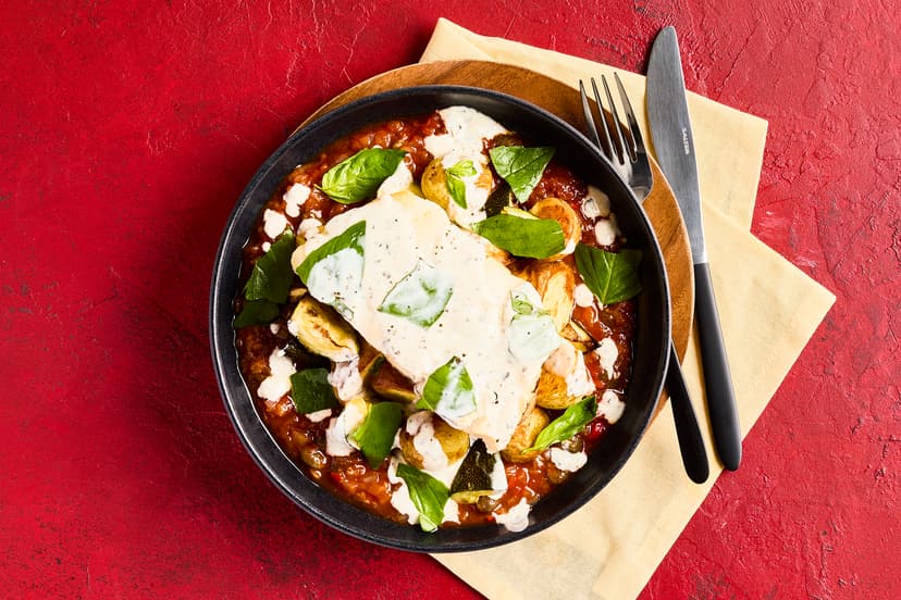 Baked hake fillets are transformed with this flavour-packed sauce of passata, capers, chilli, garlic and basil. Add roasted baby potatoes and courgettes, and a finishing touch of garlicky, herby yogurt, and you definitely won’t need to fish for compliments!