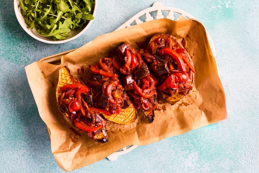 This dish ticks all the boxes – filling, super-tasty and easy to prepare. Oven-roasted sweet potatoes are topped with a lightly spiced, smoky aubergine and red pepper stew and finished with a sprinkle of rocket leaves.