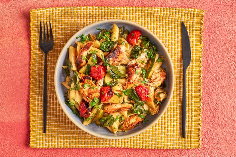 We’ve used Moroccan harissa paste to add a bit of spice to midweek chicken and pasta. The coated chicken is grilled with fresh tomatoes, then stirred into girandole pasta (posh spirals!) with onion, courgette, spinach and capers, and finished off with yogurt and parsley.