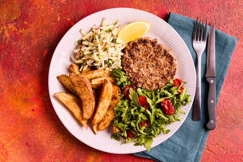 Get a taste of America’s deep south with these juicy pork patties, served with spicy potato wedges, a rocket and roast tomato salad and a fabulously refreshing cucumber and apple salsa. Itʼs a perfect midweek treat.