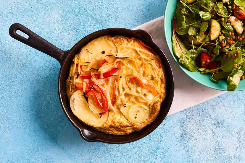 Often served bite-sized in tapas bars, we’ve turned this classic Spanish omelette into a main meal. It features thinly sliced potato layered with onions and red pepper, served with a vibrant (and super-filling) lentil, tomato and cucumber salad. In the unlikely event you have any leftovers, it’s also delicious served cold.