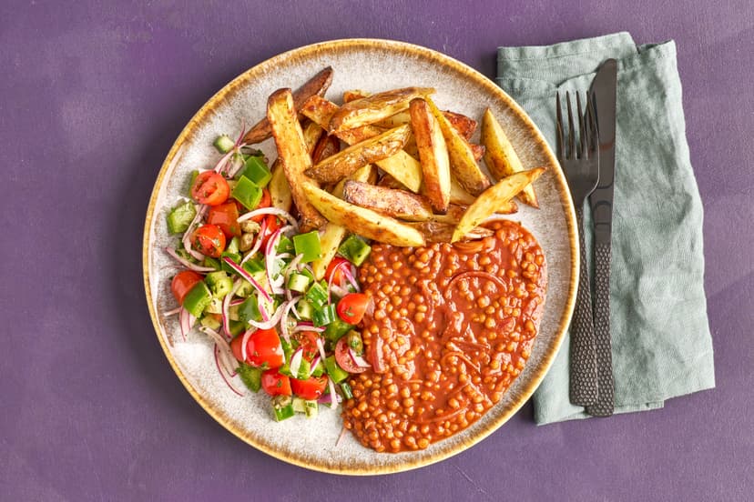 Let us whisk you off to the Greek islands with this flavourful lentil dish, fragrant with cinnamon and oregano. Protein-packed lentils are cooked in a rich onion and tomato sauce, and served with a chunky fresh salad and golden oregano-flavoured potato wedges.