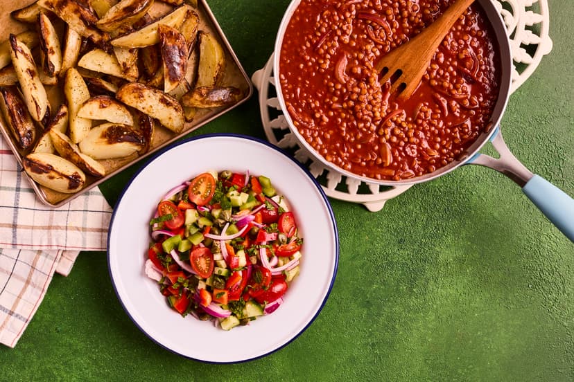 Let us whisk you off to the Greek islands with this flavourful lentil dish, fragrant with cinnamon and oregano. Protein-packed lentils are cooked in a rich onion and tomato sauce, and served with a chunky fresh salad and golden oregano-flavoured potato wedges.