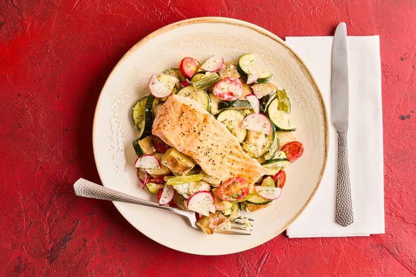 The warm potato salad is the star of this show – grilled salmon fillets are served on a bed of potatoes, courgettes, tomatoes and spring onions, with radishes for crunch, and a zingy dill and yogurt dressing.