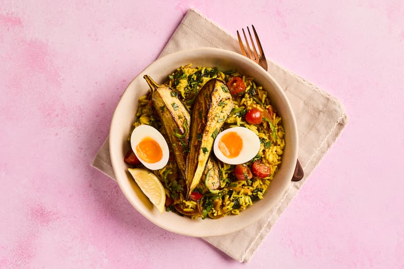 You’ll love our veggie twist on kedgeree, a lightly curried rice dish that’s delicious for brunch, lunch or dinner. Tomato, onion and spinach are cooked with mild curry spices, stirred through basmati rice with yogurt, coriander and lemon, and served with roasted aubergine – plus the classic finishing touch, a hard-boiled egg.