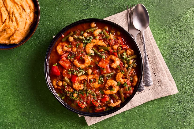 Inspired by rustic Spanish cooking, this is a treat for the eyes as well as the taste buds. Our colourful stew stars juicy prawns, chickpeas, red pepper and green beans in a tomato sauce rich with paprika, spooned over golden potato and sweet potato mash.