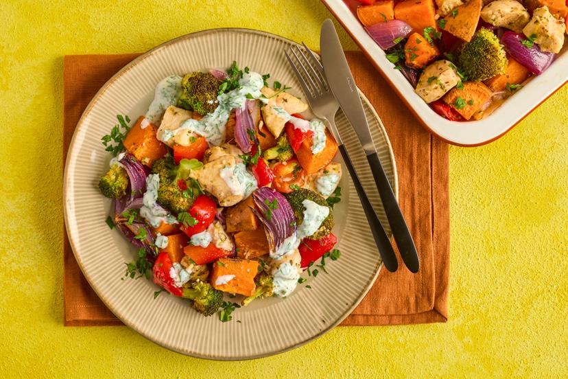 Winner, winner, chicken dinner! Chunks of chicken breast are cooked with fragrant lemon, garlic and thyme, and served with roasted broccoli, onion, pepper and sweet potato, with a dollop of herby yogurt. It’s all baked in the oven, so there’s minimal washing up too!