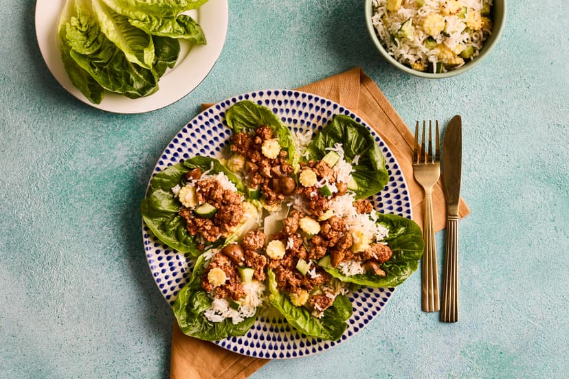 Also known as ʼsan choy bowʼ, these are little cups of joy! Lean pork mince is stir-fried with mushrooms, Chinese five spice and tamari, while fluffy white rice is mixed with garlicky, gingery sliced baby corn and diced cucumber. Then – the fun bit! – you pile it all into gem lettuce leaves.