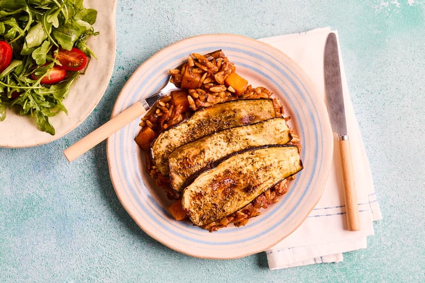 Mint, cinnamon, oregano and garlic will waft you to the Greek islands thanks to this aromatic pasta dish. Orzo (small rice-like pasta) is stirred into a deliciously rich tomato sauce, topped with roast aubergine and baked until golden. It’s all served with a fresh rocket and tomato salad.