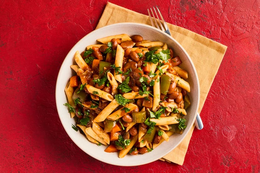 Rich and creamy borlotti beans are high in fibre and protein, so they add flavour and a whole lotti filling power to this bolognese with a twist! Mixed with green pepper, carrot and chestnut and porcini mushrooms in a herby tomato sauce, they’re then stirred into pasta and served with a sprinkle of parsley.