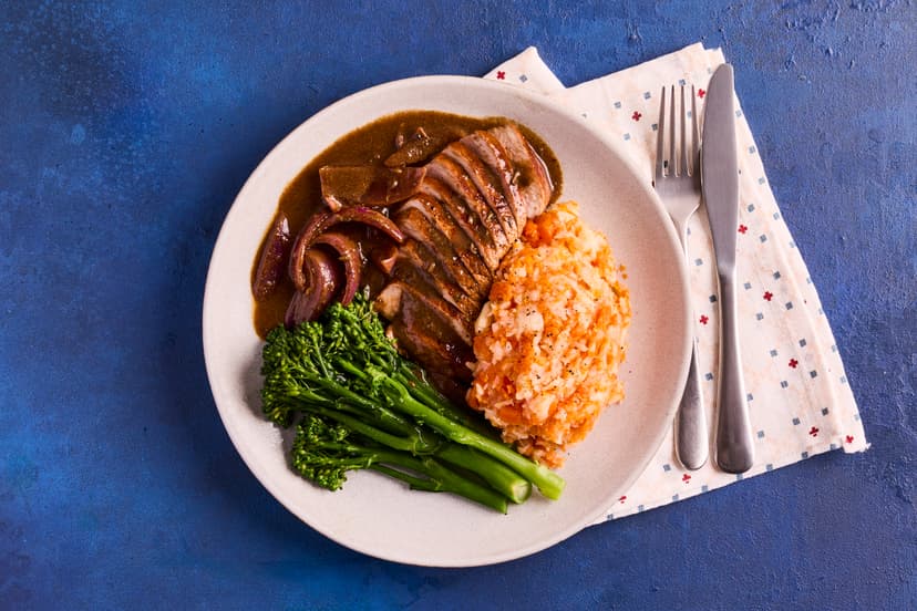 Make a weeknight dinner feel like a special occasion with this posh pork dish. Tasty tenderloin with a balsamic glaze is served with mashed celeriac and carrot, with broccoli on the side, smothered in an aromatic onion gravy infused with rosemary and fennel.