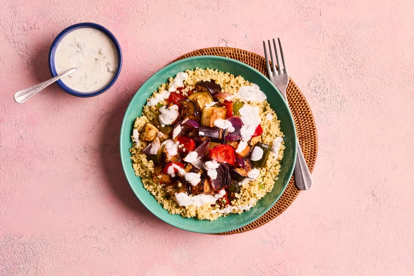 Spice up your life with this roasted veg medley - aubergine, red onion, pepper and courgette, roasted with garlic and chilli, and served on a fluffy bed of couscous scented with lemon zest, finished with a drizzle of minty yogurt.