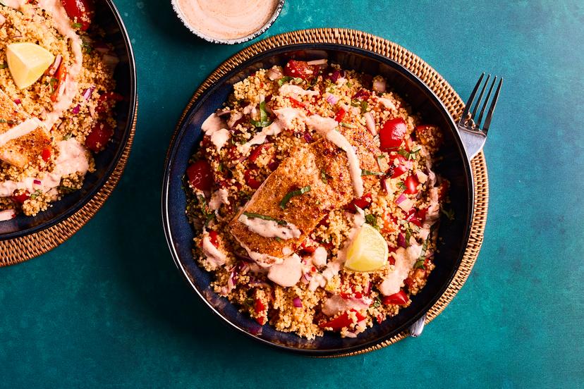 Prepare for a tastebud tingler! Salmon fillets are roasted in our special peri-peri spice blend and served with couscous packed with red pepper, tomato, onion, basil, garlic and chilli – with a cooling drizzle of yogurt and a spritz of lime.