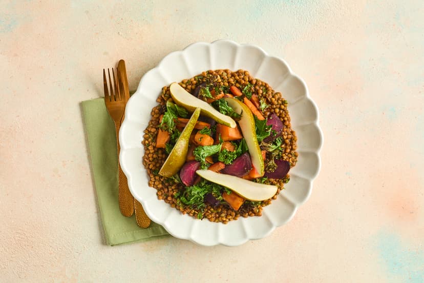 This earthy-sweet dish definitely marches to a different beet! With roasted beetroot, carrot and sweet potato, crispy kale, and garlicky, herby lentils - plus a surprising fruity garnish - this bold and beautiful salad is absolutely pear-fect.