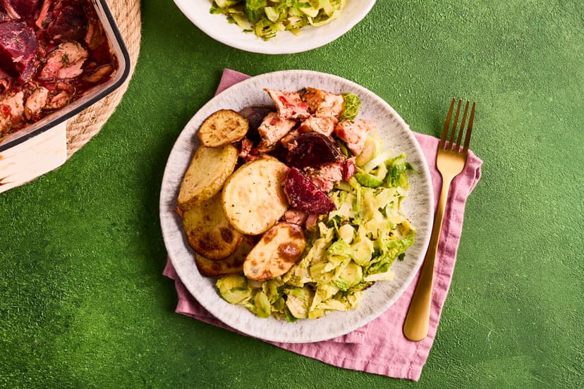 Santa baby, slip this salmon under the tree, for me... Tender flakes of salmon are combined with beetroot and onion in a dill-infused yogurt sauce, then topped with potato slices and baked till bubbling. Served with sautéed shredded cabbage, leek and Brussels. Stick it on your Christmas wish list!