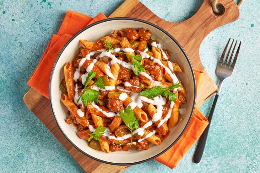 We’ve given hearty Hungarian goulash a twist by combining it with pasta! Our take on the classic stew features quick-cook beef mince, onion, green pepper and tomatoes, flavoured with garlic, thyme and paprika. A drizzle of yogurt and a sprinkling of parsley add a final flourish to this fusion feast.
