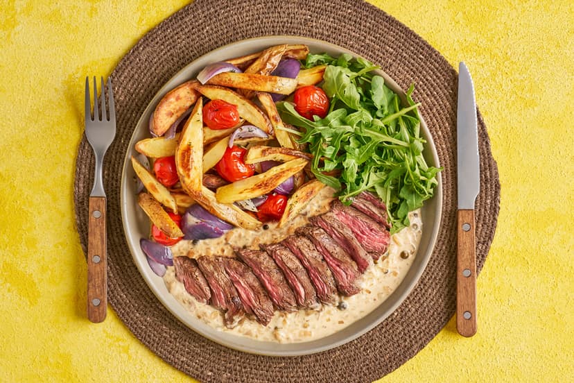 A juicy steak and pile of chips is always a winner. We’ve raised the bar with roasted onions and baby tomatoes, peppery rocket and a dreamy, creamy sauce made with green peppercorns, shallot and garlic.