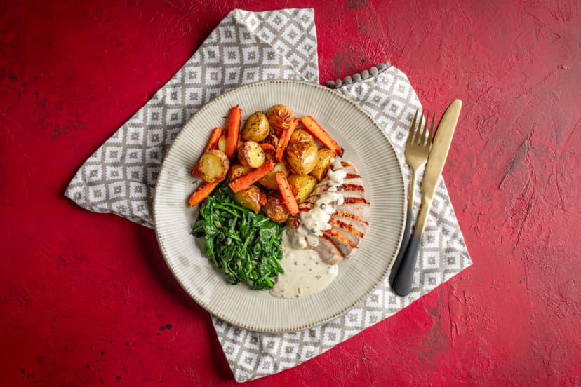 This saucy little number has a little extra oomph courtesy of the piquant green peppercorns that spice up the creamy herb and shallot reduction. Pour it over juicy pork slices, roasted carrots and potatoes and nutmeg-sprinkled spinach and... ooh la la! A divine dinner time is yours.