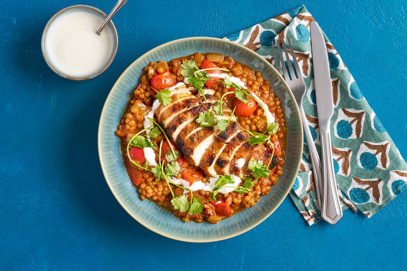 Keep calm and curry on! This mildly spiced sauce is a doddle to whip up with onion, red pepper, tomatoes, passata and lentils. Chicken breasts are sprinkled with garam masala and curry powder, then grilled. Twenty minutes later, all that’s left to do is drizzle with yogurt, scatter on some coriander and tuck in.