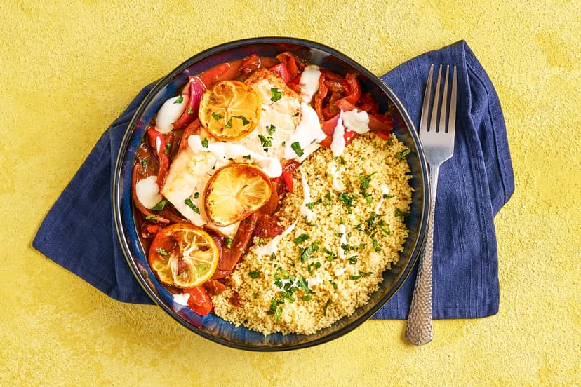 Tender cod fillets topped with lemon sit on a bed of onions and peppers in a warmly spiced Middle Eastern tomato sauce, served with fluffy couscous and a sprinkling of mint and parsley. We’ve put the ooo into couscous!