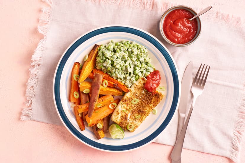You’ll fall in love with our chippy tea with a Caribbean twist. Tender cod is baked in jerk spices, and served with sweet potato and carrot fries, tangy jerk ketchup, peas crushed with mint and yogurt, and a final flourish of lime and spring onion.
