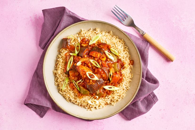 Aubergines and lentils are a match made in heaven in this super-filling Mexican stew. They’re cooked with onion and green pepper in a tomato sauce rich with garlic, chipotle paste and smoked paprika, served over fluffy basmati rice with a sprinkling of spring onion.