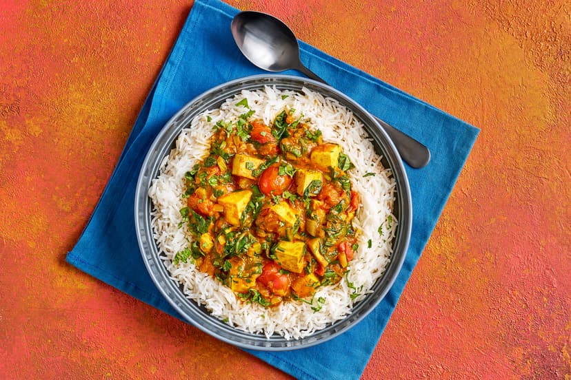 The genius of tofu is that, as well as being rich in protein (so it’s super-filling), it absorbs the flavours it’s cooked with. Here it’s simmered with onion, tomatoes and spinach, in a rich curry sauce, and served with basmati rice and a sprinkling of coriander. Enjoy!