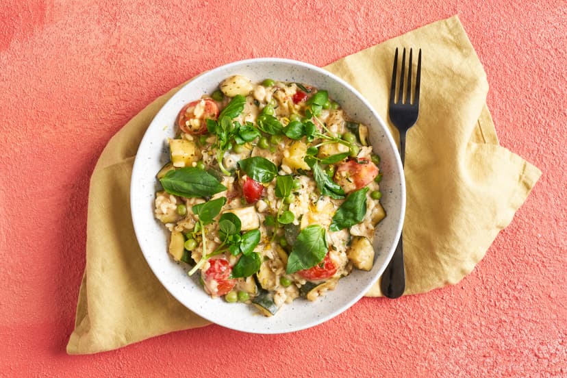 Every mouthful of this dish zings with the taste of summer. Onion, courgette and baby tomatoes are stirred with yogurt into arborio rice, scented with garlic, herbs, sun-dried tomato and lemon. It’s finished with lemon zest, pea shoots and fresh basil – pretty as a picture!