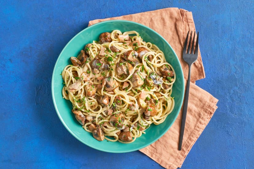 We’ve added a twist to a classic carbonara by adding earthy chestnut mushrooms, the umami flavour of miso paste and citrussy green peppercorns. With smoked bacon, they’re stirred into heaps of spaghetti with egg and yogurt, finished with a sprinkle of fresh parsley. Give it a twirl!