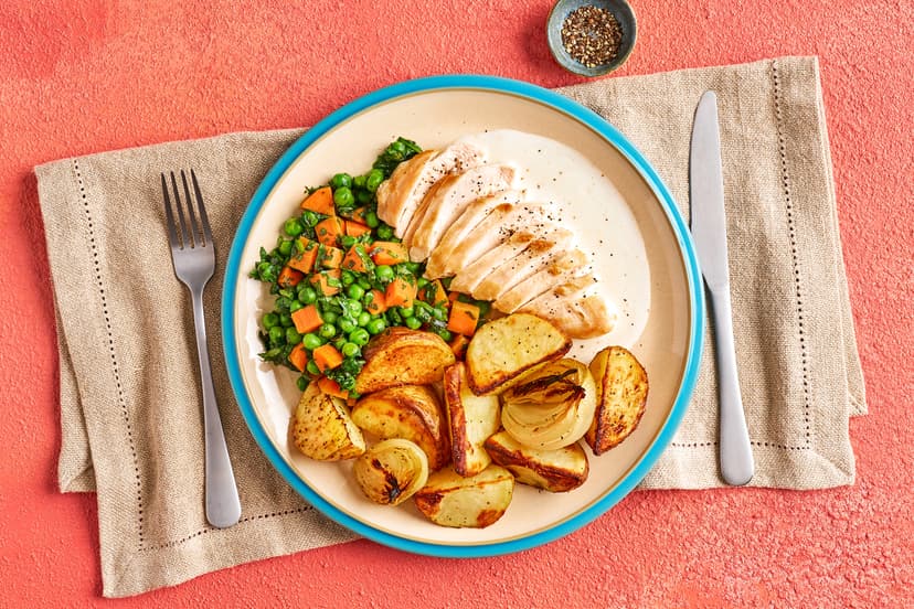 We’ve given roast chicken dinner a summery makeover. Tender slices of chicken breast are served with golden roast potatoes and onions and a marvellously minty medley of carrots, peas and spinach, finished with a light yogurt sauce. Mmm.