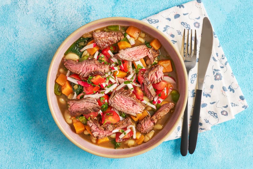 Dish up a little sunshine, South America-style. Tender bavette steaks are seared in our bespoke Slimming World tempero baiano spice blend, then sliced and served over a satisfying white bean and sweet potato stew, with a zingy tomato and radish salsa.