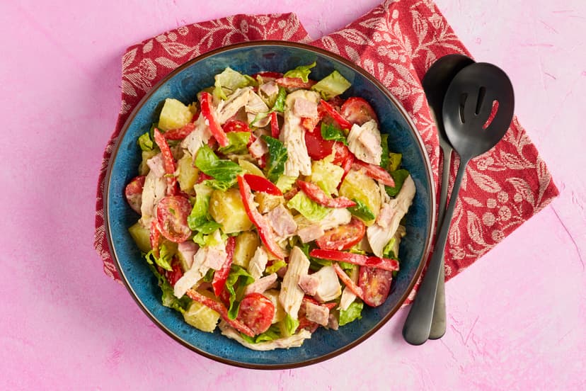 This satisfying salad is all killer no filler! It’s packed with chunks of grilled chicken breast and tasty bacon, boiled spuds and crisp pepper, lettuce and tomatoes, then tossed in a light garlic and herb yogurt dressing.