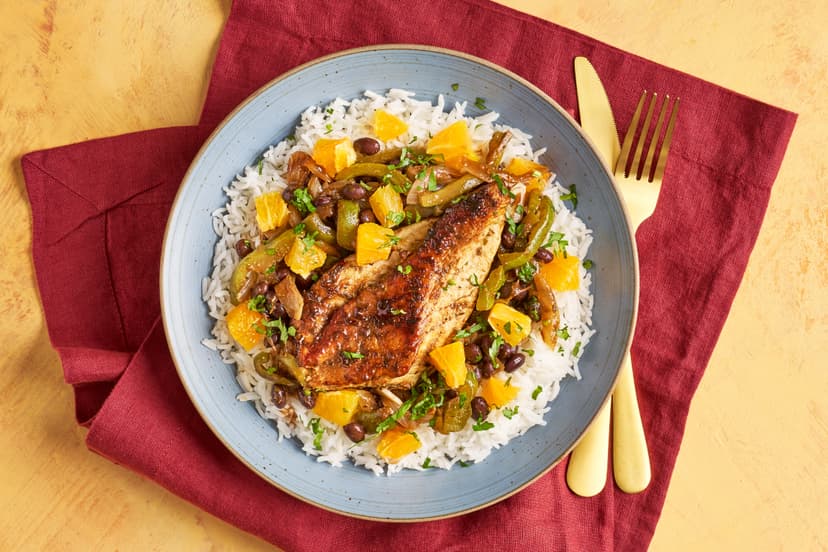 Just like the sultry, salsa-mad island it hails from, this flavour-packed dish is full of life! Butterflied chicken breasts get a quick dip in a lime juice, cumin and oregano marinade, then they’re sizzled in a pan, served on a spiced black bean, green pepper and coriander stew and bed of basmati rice, all topped with juicy chunks of orange.
