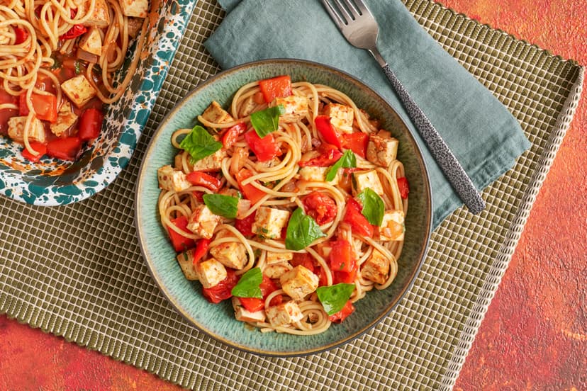 Roasted tofu, sweet peppers, soft onions and juicy baby tomatoes, all tangled with spaghetti in a rich sun-dried tomato, garlic and basil sauce – then baked until bubbling. It’s rich, it’s saucy, it’s got a warming chilli kick… it might just be your new favourite.