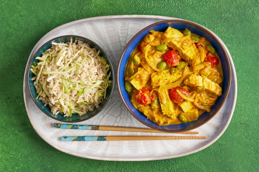 If you’ve fallen for Japan’s iconic curry dish you’ll love our fresh and light fakeaway! Chunks of tofu are simmered with tomatoes, spring onions and edamame beans, and in a magic touch we’ve used mashed sweet potato to add body and flavour to the mild curry sauce. It’s served with cabbage-flecked rice.