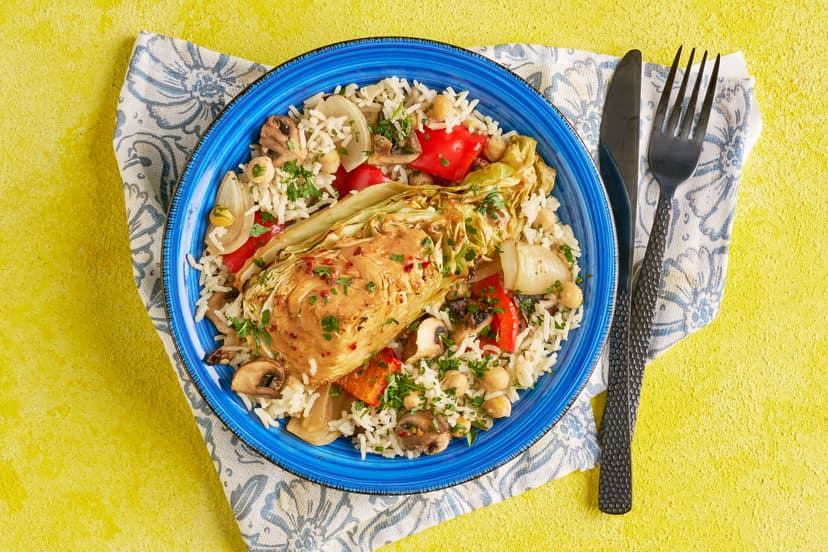Don’t miso out on this one! Sweetheart cabbage gets the star treatment with a punchy chilli, garlic, soy and miso drizzle. It's then roasted along with onion wedges, red pepper and mushrooms, and served with chickpea and coriander-speckled rice and a sprinkling of fresh parsley.