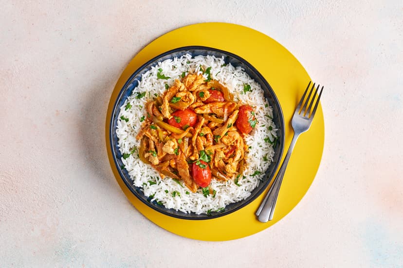 A sprinkle of mustard powder adds a tangy twist to this feast of flash-fried pork strips, green pepper and baby tomatoes. Simmered in a tomato sauce with a kick of Henderson’s Relish and soy, it’s spooned over herby basmati rice to catch every last drop. Devilishly tasty and – as it’s ready in 20 – just as hasty!