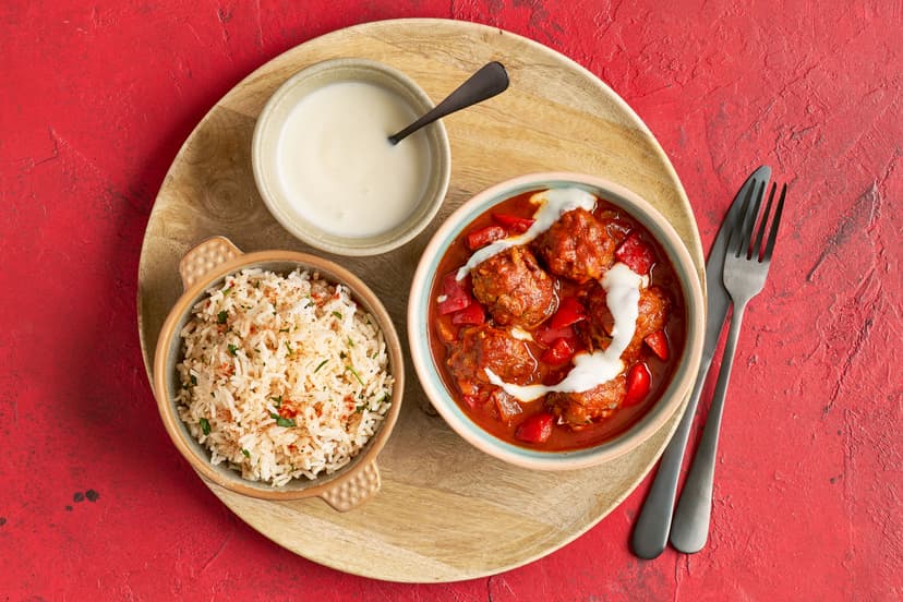 These meatballs are our take on tapas favourite albondigas. Made with beef, grated courgette and smoked paprika, they’re smothered in a seriously flavoursome sun-dried tomato and pepper sauce, and plated up with smoky, parsley-packed rice and garlicky yogurt for drizzling. It’s Barcelona bar vibes without the air fare!