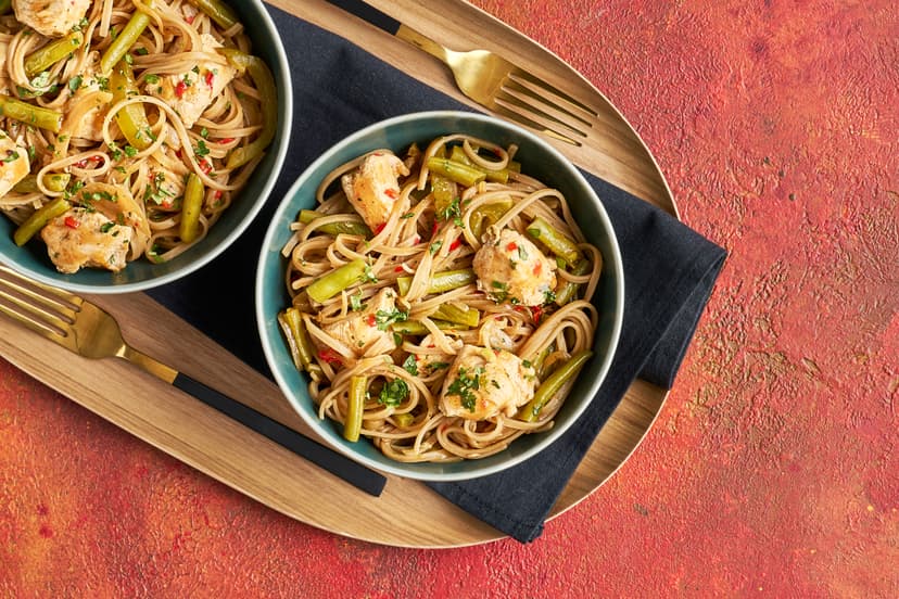 Umami is Japan's word for 'delicious savoury taste', and this hearty noodle bowl doesn't disappoint! Chicken, onion, green beans, pepper and a little chilli are stir-fried, then lightly simmered in a broth perked up with miso, gochujang and tamari. Filling wholemeal noodles and coriander seal the deal.