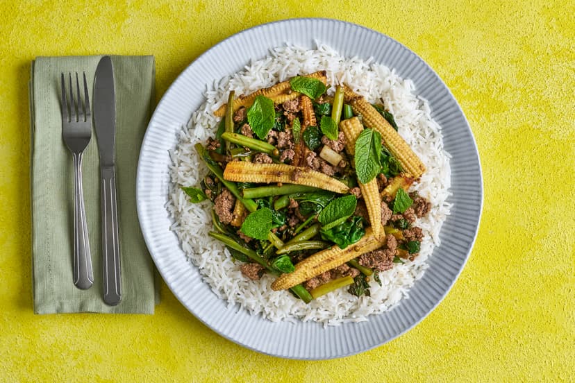 Green peppercorns are milder than black, and they give a fresh, tangy taste to this beefy stir-fry. Chilli, garlic and soy boost the flavour, while green beans, baby corn, spinach and spring onions bring veg-packed goodness. It’s served with fluffy rice and refreshing mint.