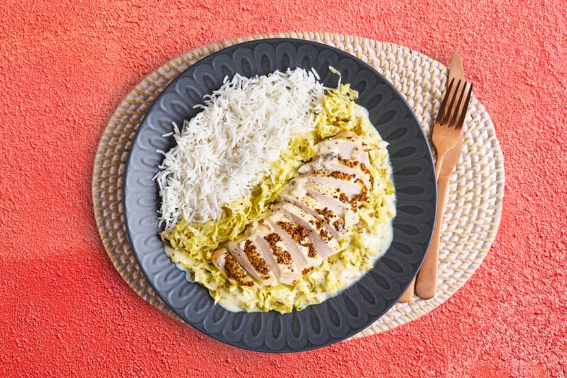 Grilled chicken breasts brushed with wholegrain mustard, served on a bed of garlicky, herby creamed cabbage and leek, with fluffy rice to scoop up every last bit. It’s soothing, cosy, pure contentment…