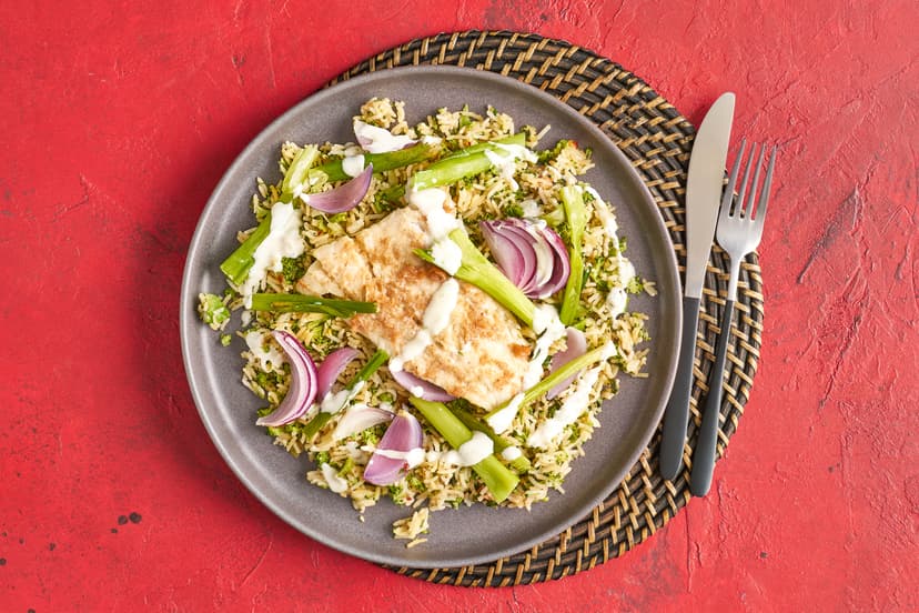 Oh. My. Cod! Your favourite fish has had a full-on makeover in this fresh, zesty and utterly irresistible dish. Cod fillets are coated in fragrant lemongrass purée, then baked on a bed of spring onions and served with broccoli-packed basmati rice brightened with lime, coriander and chilli flakes. Drizzle over lime yogurt and ready yourself for the compliments…