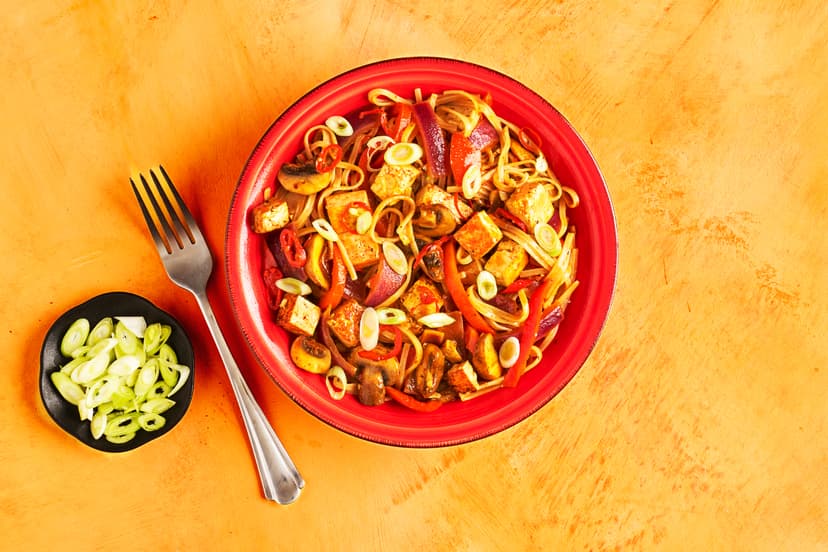 This super-speedy, surprisingly simple and seriously tasty stir-fry is proof that big flavour doesn’t have to mean big effort. Tofu, red pepper, chestnut mushrooms and rice noodles are simmered in a punchy sauce made with sliced chilli and a squeeze of our sun-dried tomato and harissa pastes, then sprinkled with spring onions. Cook it in a flash, devour at your leisure…