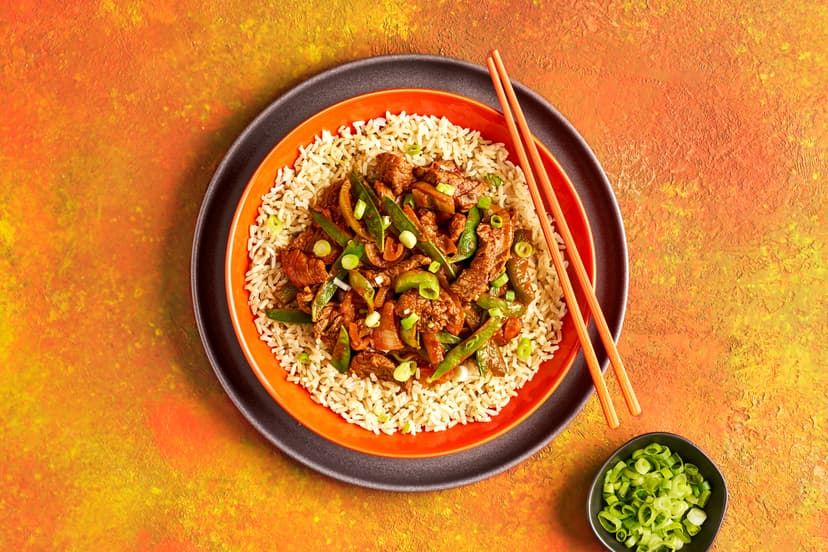 Just what is gochujang? It’s a savoury and spicy chilli and soy bean paste that’s popular in Korean cooking. Here, it takes a simple stir-fry to complex new umami depths and adds a touch of heat to our ginger and garlic steak marinade. Simmered with onion, green pepper, mangetout and passata, then spooned over brown rice and scattered with spring onions, you’ve goch to get this into your life!