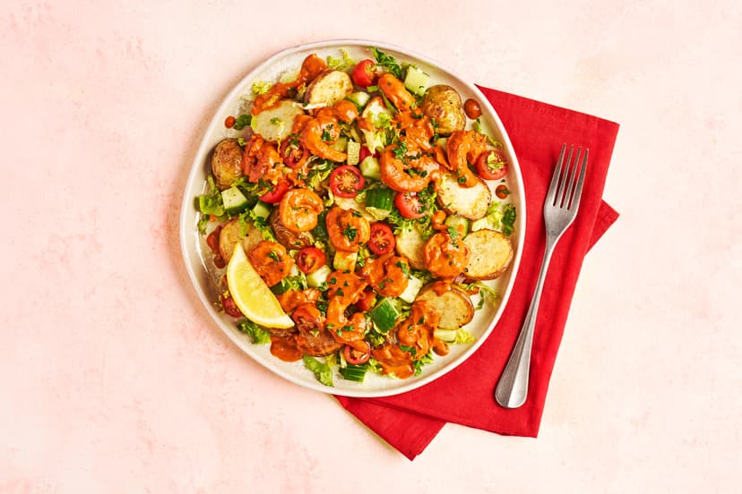 It’s the 70s starter we all secretly love – and we’ve made a meal of it! Juicy prawns are sautéed with garlic and smoky paprika, then tossed through a lightened-up Marie-Rose sauce with a sprinkle of parsley and a squeeze of lemon. Serve on a bed of baby potatoes for satisfaction, and a classic cocktail-style salad of crunchy cucumber, lettuce and cherry toms. Retro never tasted so right.