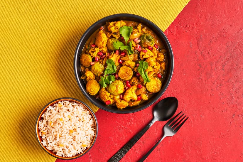 Mellow korma might be the most comforting curry of them all. And this vegan one takes things further... Roasted Brussels and cauliflower, dusted with cardamom, curry powder and cinnamon, bring toasty depth; mashed sweet potato enriches the sauce; and a scattering of pomegranate adds sparkle. Served with brown rice and a coriander garnish, it’s comfort food at its most golden.